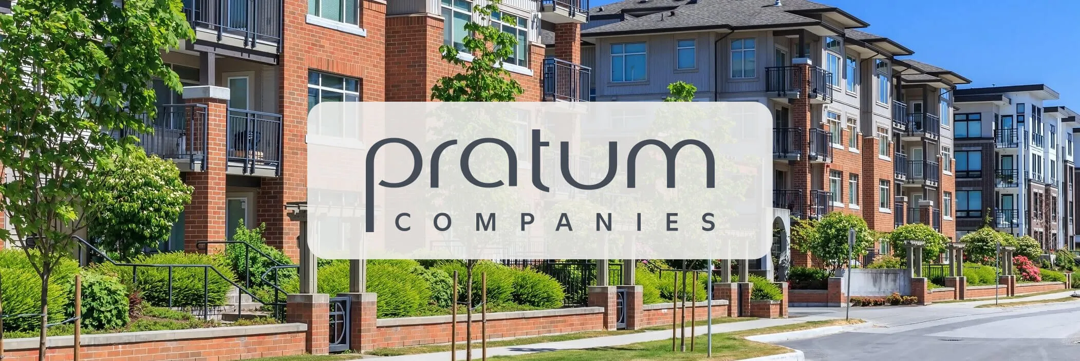 A residential property complex with pratum logo