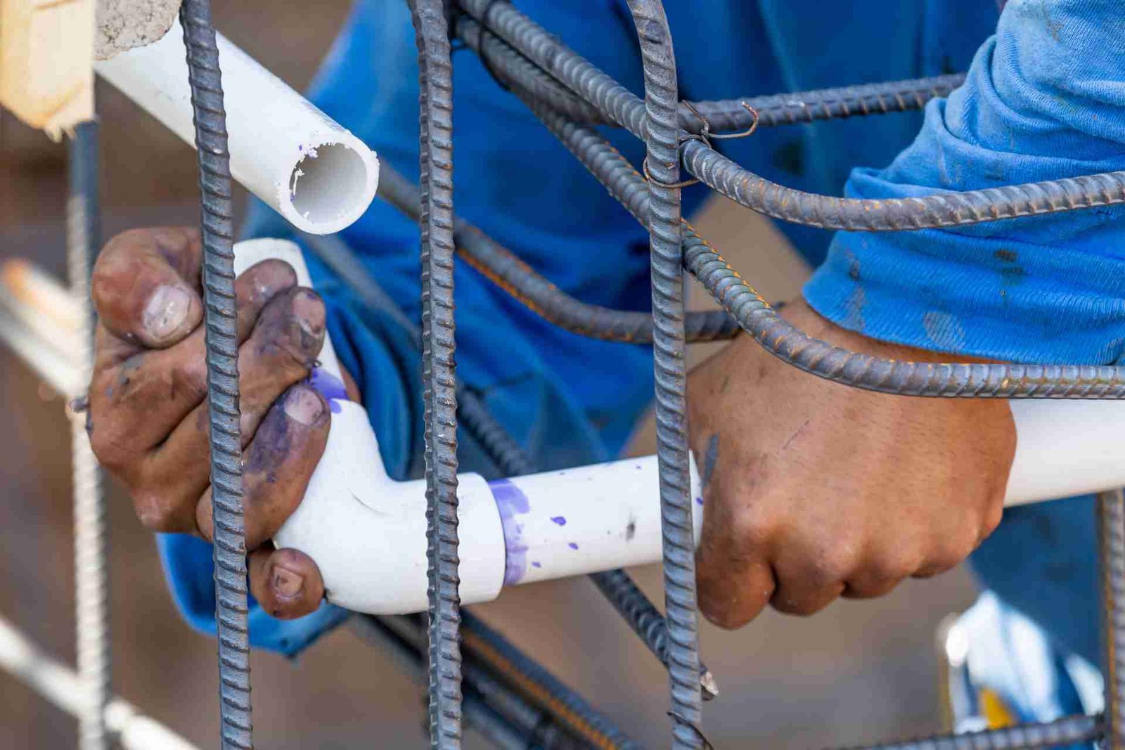 Man connecting two pvc pipes