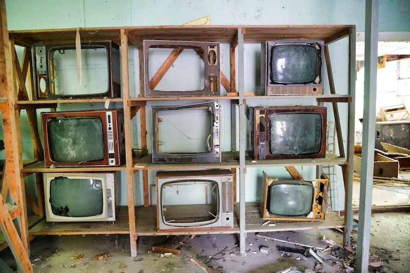 Shelves of old tvs that are now e-waste