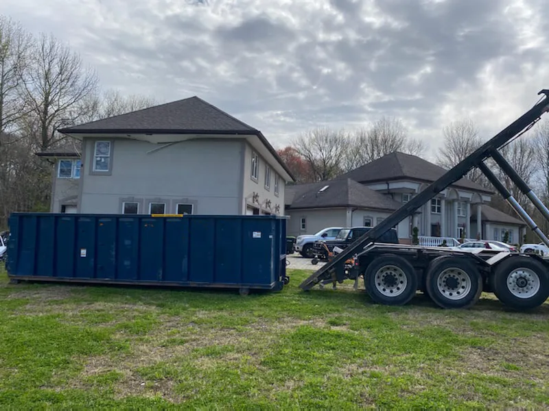 Roll off truck delivering 30 yard dumpster rental in Fairfax County Virginia