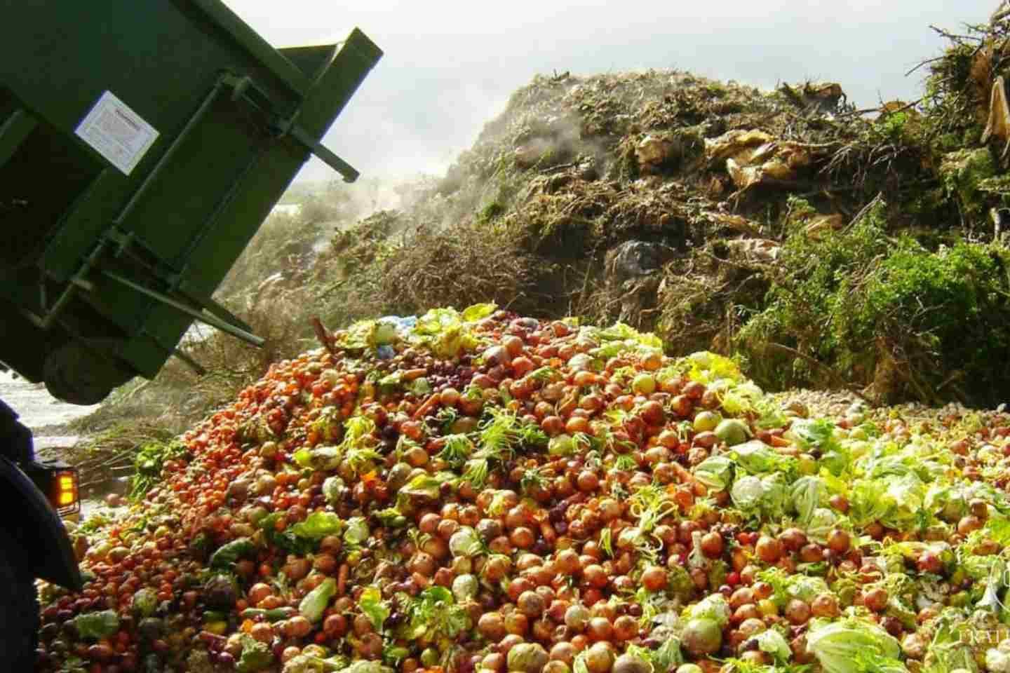 a truck dumping food waste
