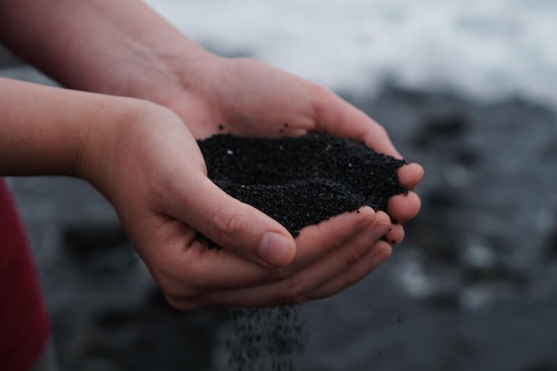 Composting soil in a persons hand