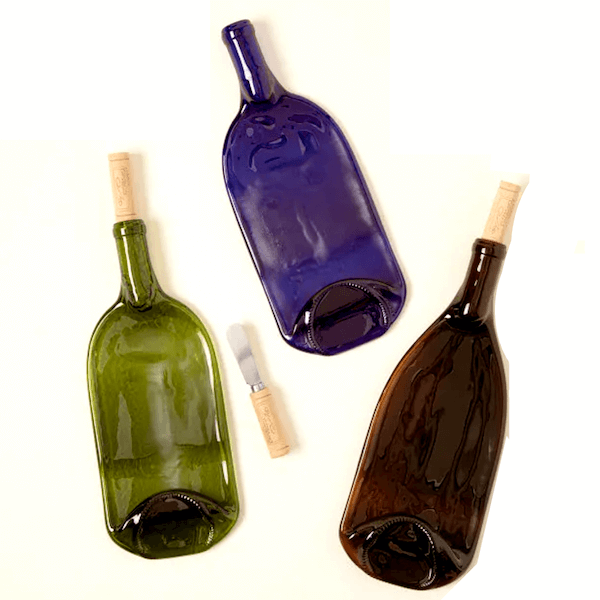 3 wine bottle platters made from recycled wine bottles. Green, blue, and brown