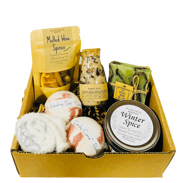 Box of Christmas spa stuff with bath balls, soap, and other goods