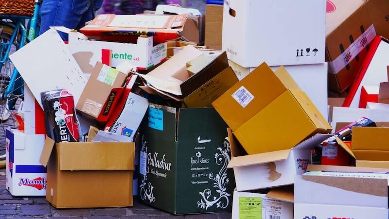 Facts about junk removal and a pile of cardboard boxes