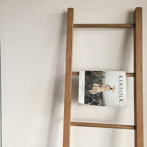 ladder repurposed as bookshelf