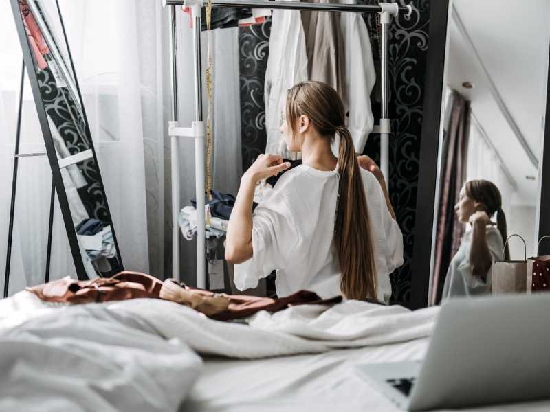 Woman sorting through clothes