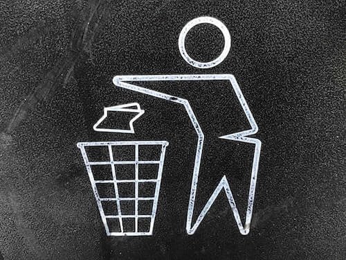 Chalk outline of person throwing litter away for landfill decomposition